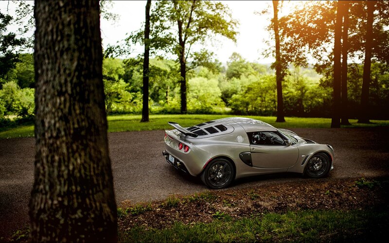 Silver sports car in forest