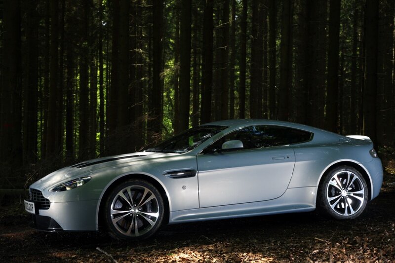 Silver sports car in forest