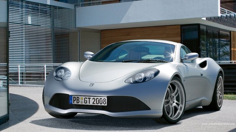 silver sports car in front of modern house