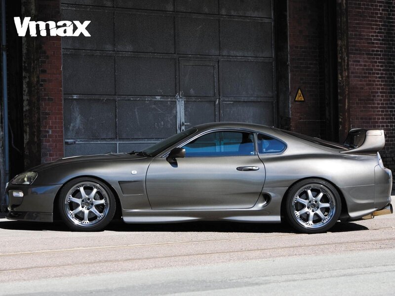 silver sports car in garage