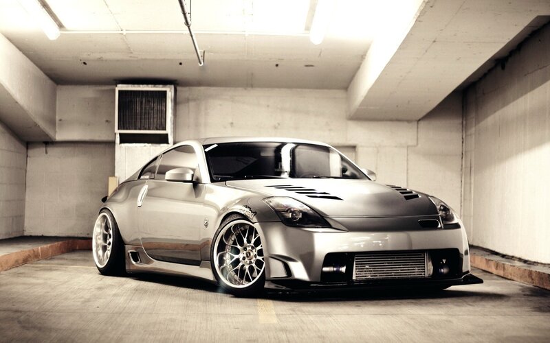 silver sports car in garage