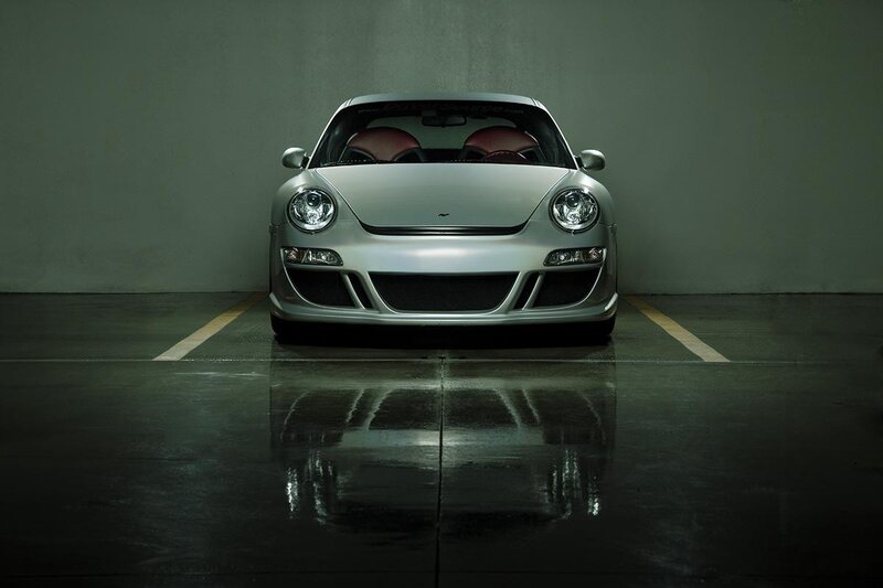 silver sports car in garage