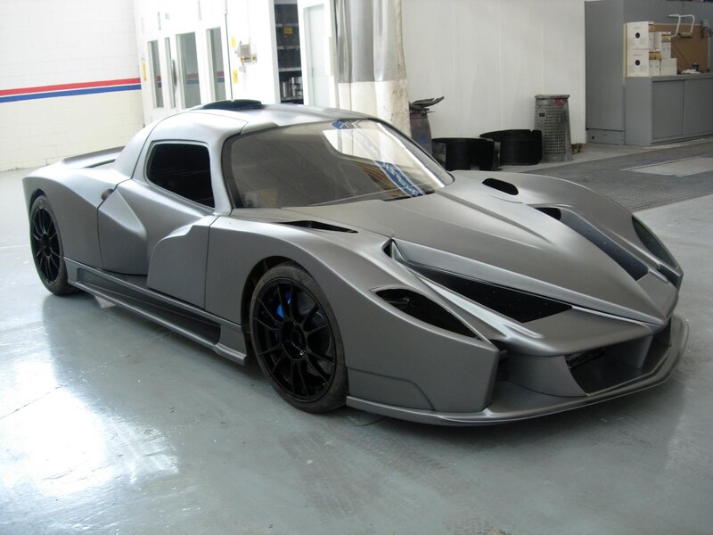 silver sports car in garage