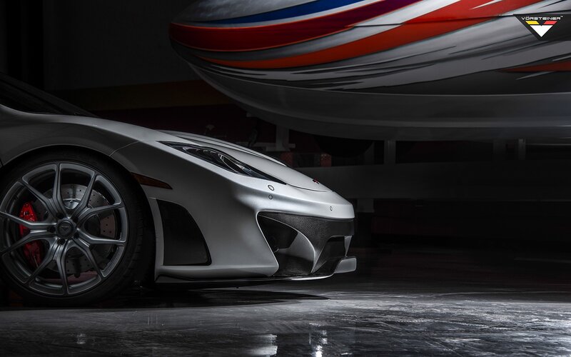 silver sports car in garage