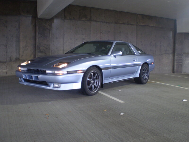 silver sports car in garage