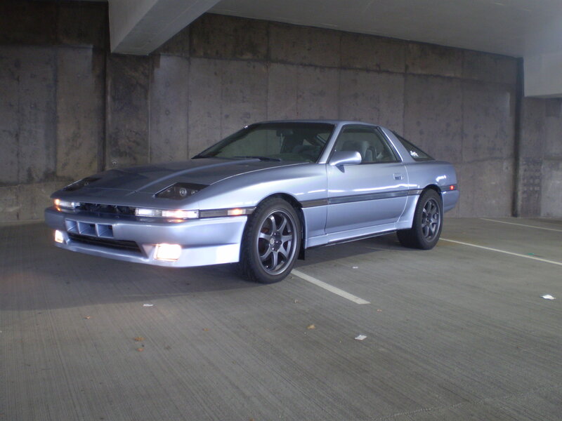 Silver sports car in garage