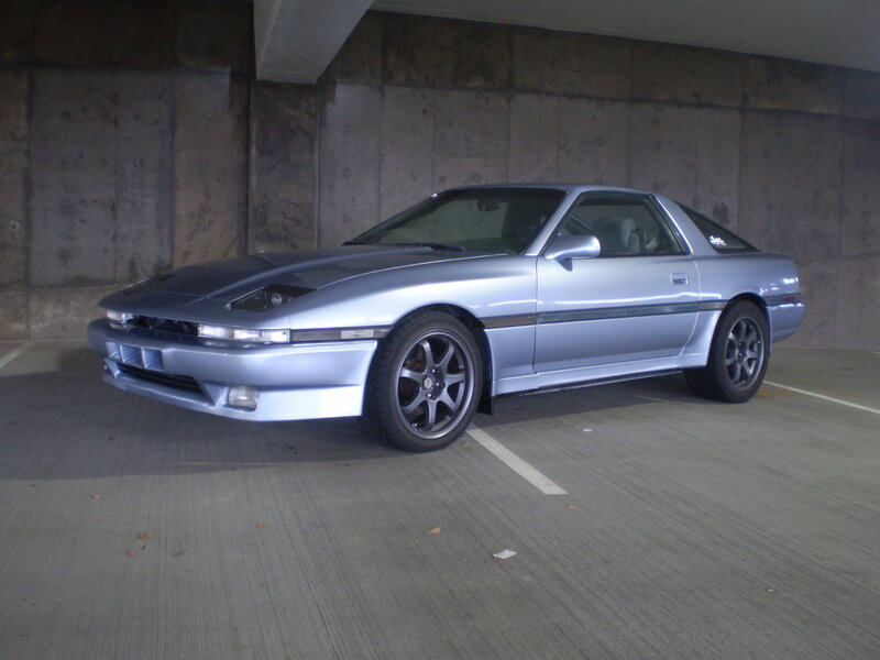 silver sports car in garage