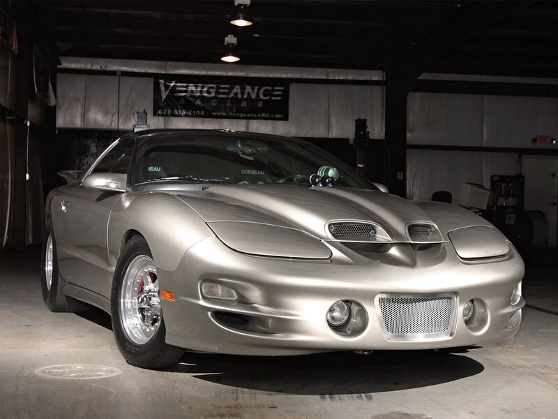 silver sports car in garage