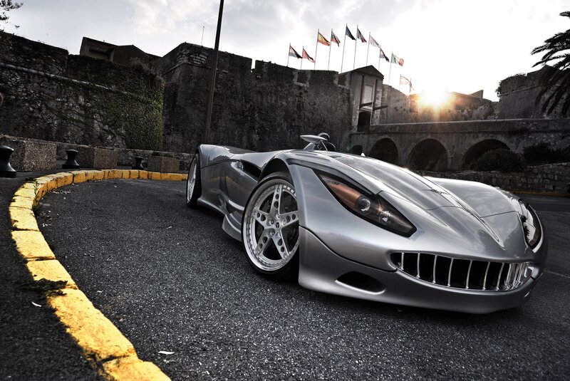 Silver sports car in historic setting