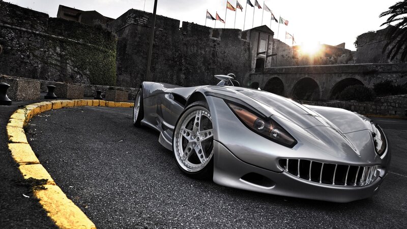 Silver sports car in historic setting