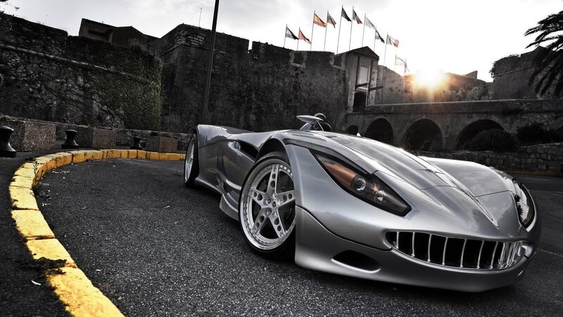 Silver sports car in historic setting