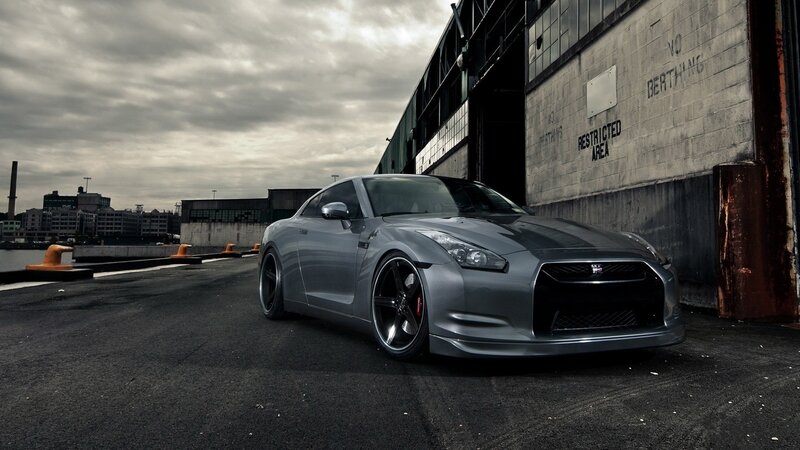silver sports car in industrial area