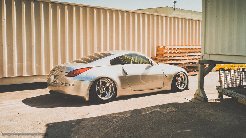 silver sports car in industrial lot