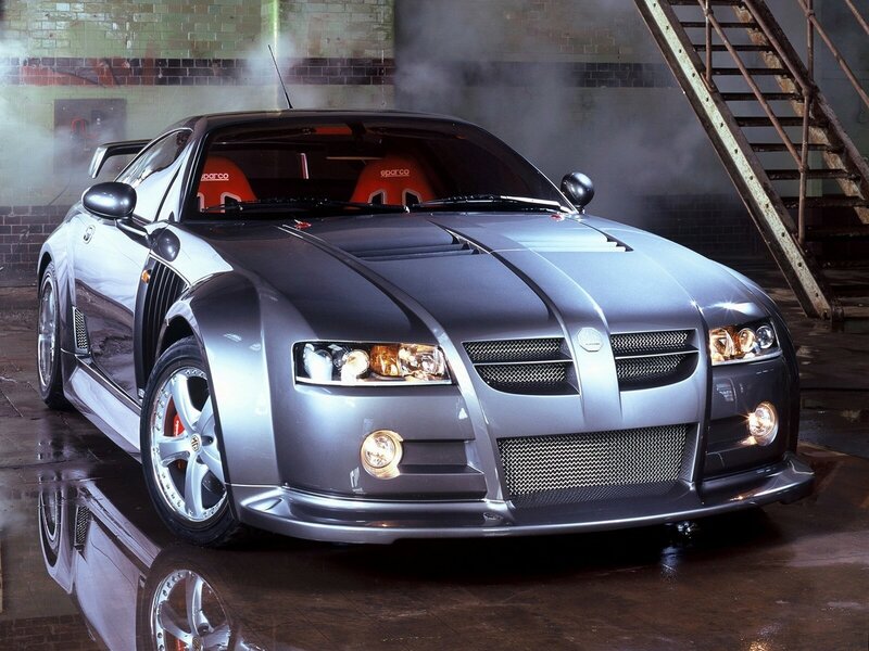 silver sports car in industrial setting