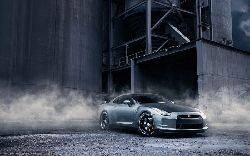 Silver sports car in industrial setting