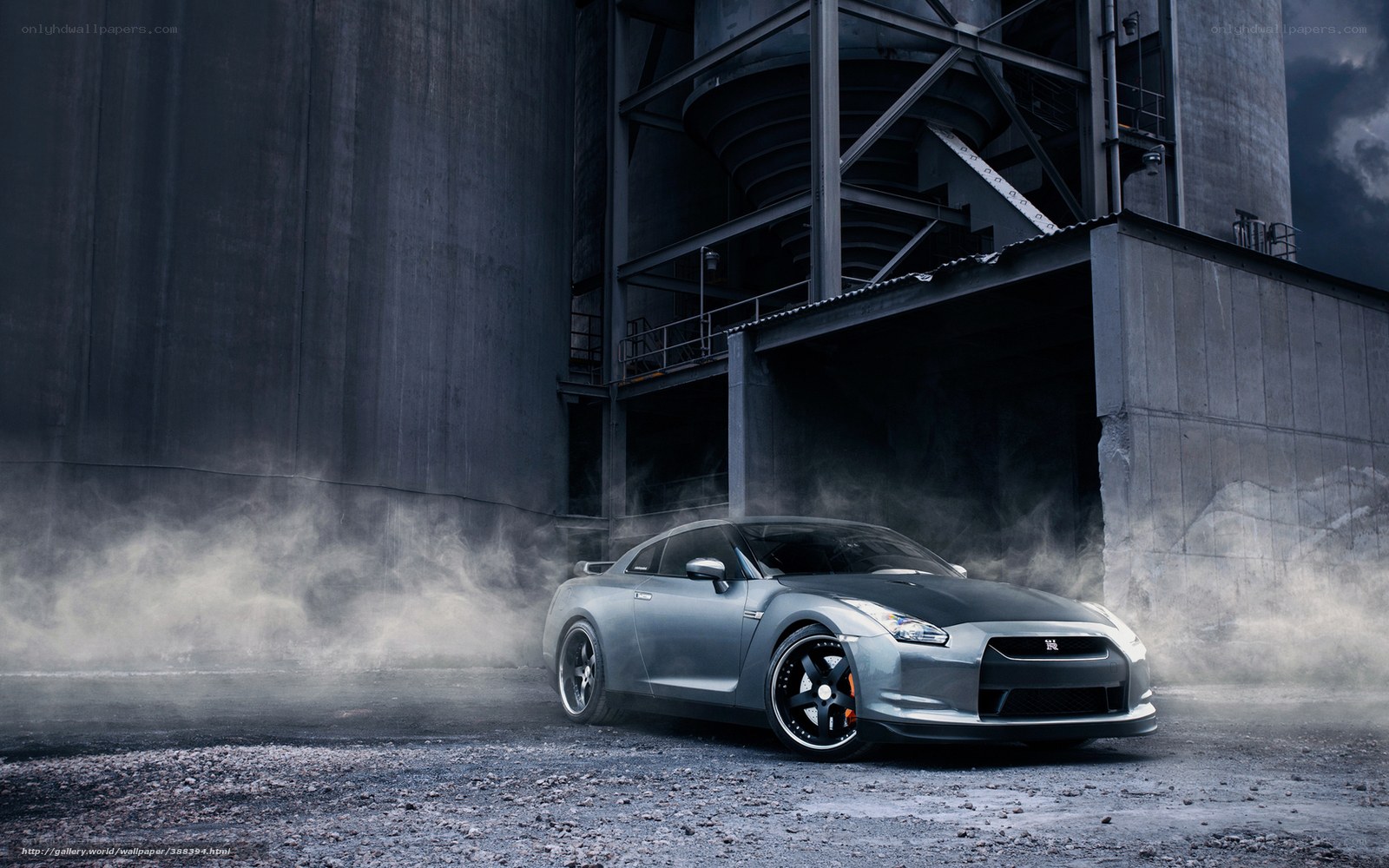 Silver sports car in industrial setting