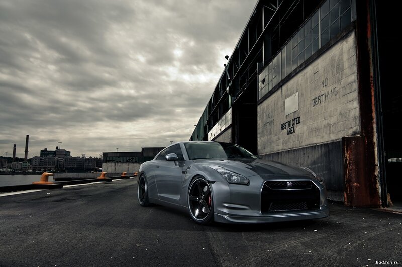 silver sports car in industrial setting
