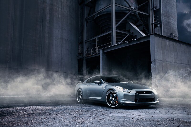 Silver sports car in industrial setting