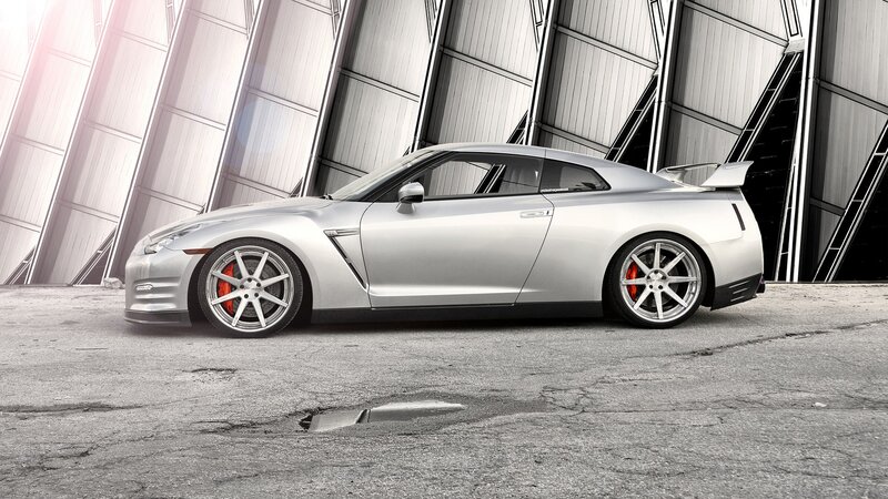 silver sports car in industrial setting