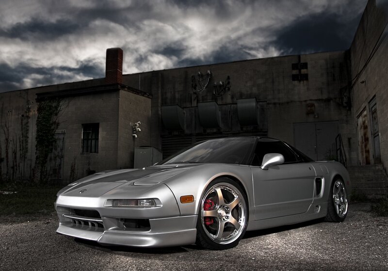 Silver sports car in industrial setting