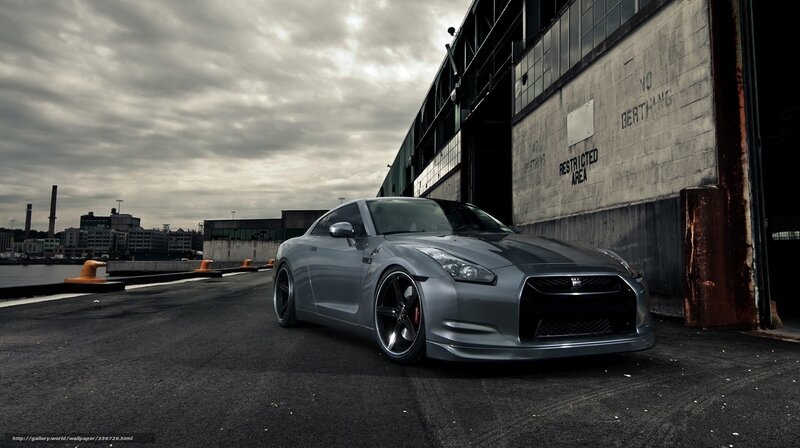 silver sports car in industrial setting