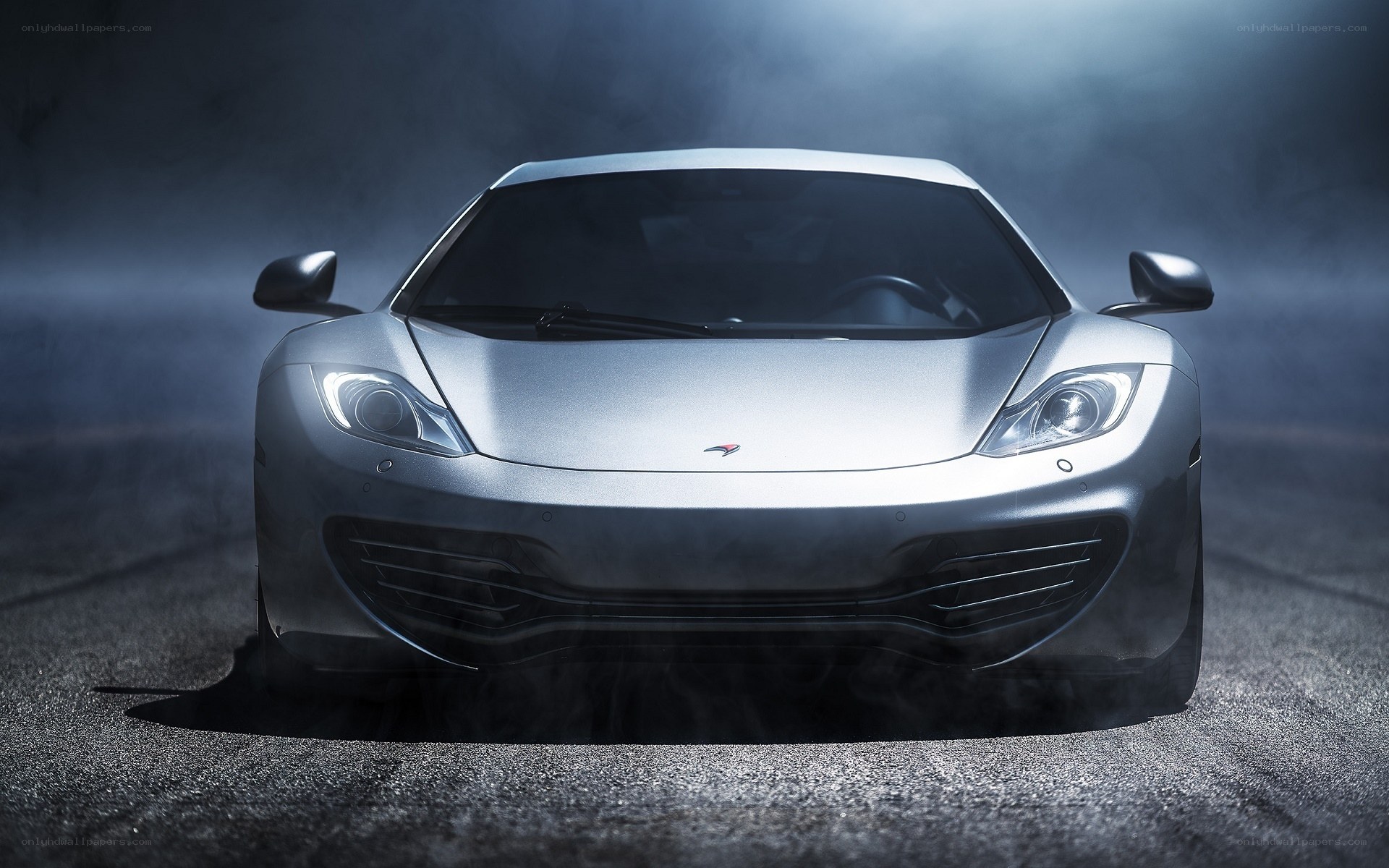 silver sports car in mist