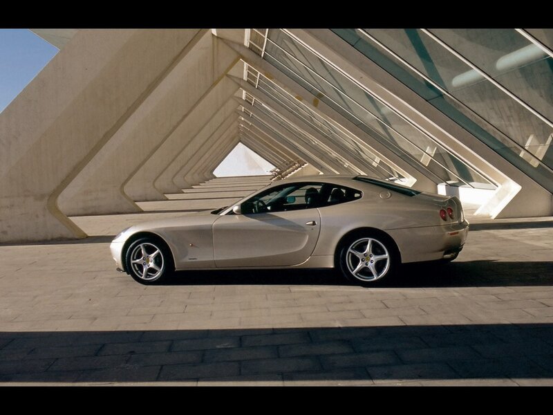 silver sports car in modern architecture