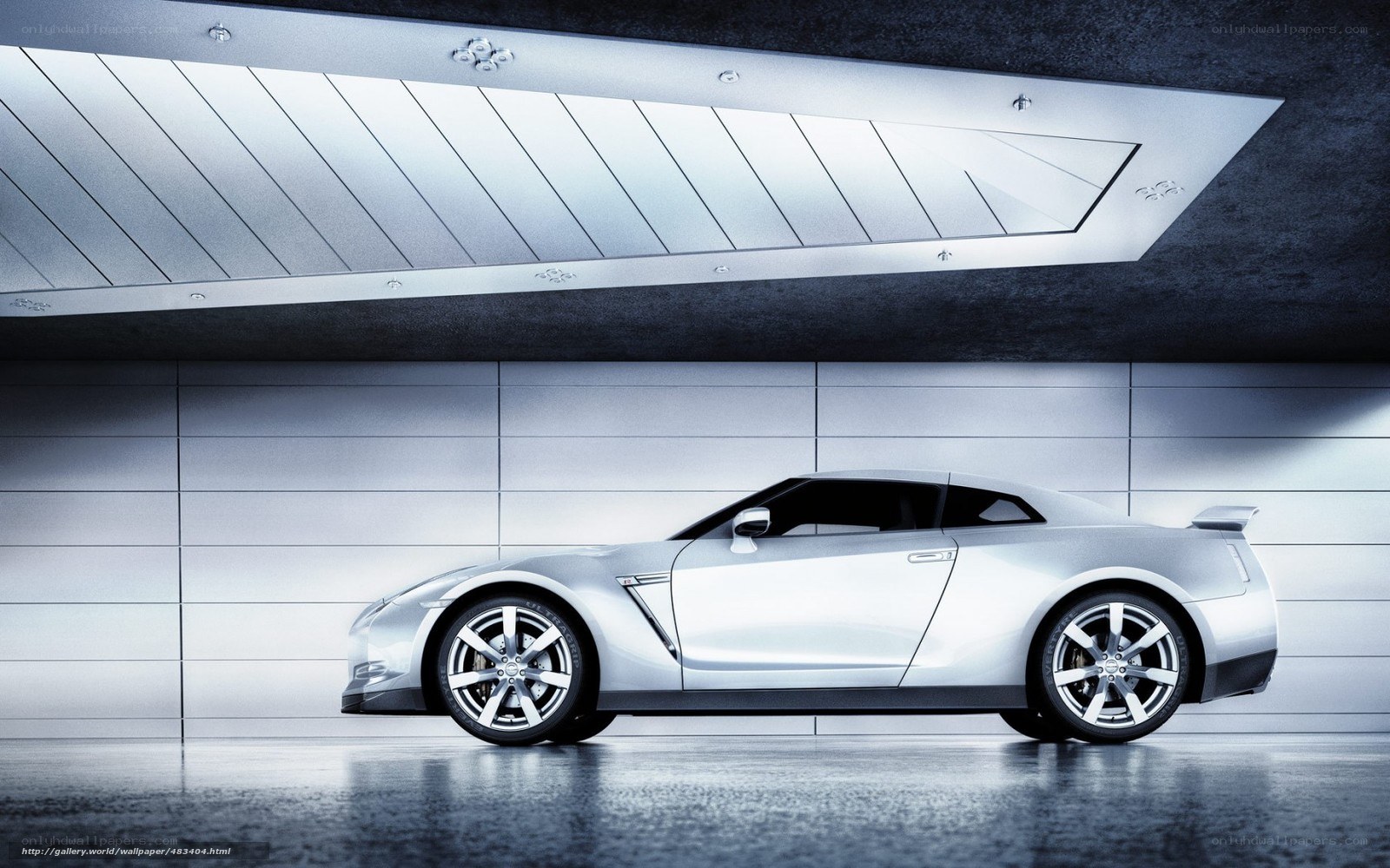 Silver sports car in modern garage