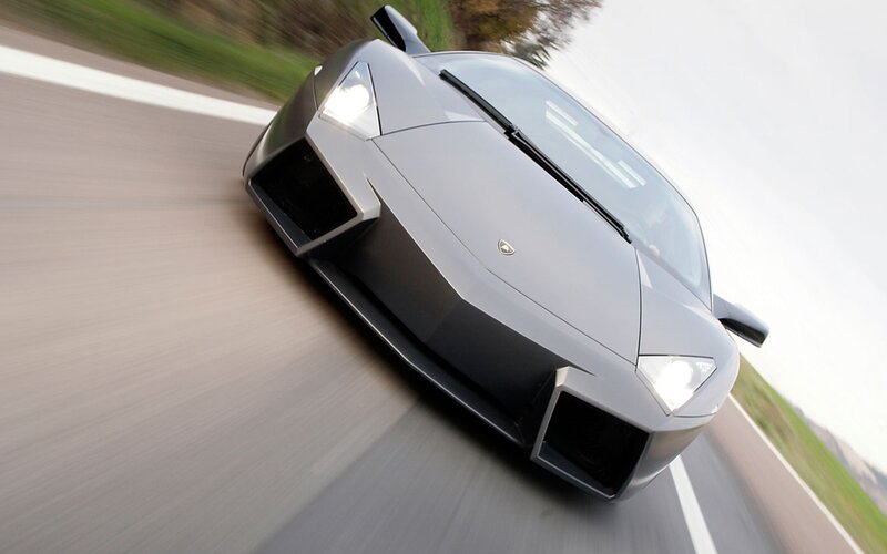 silver sports car in motion