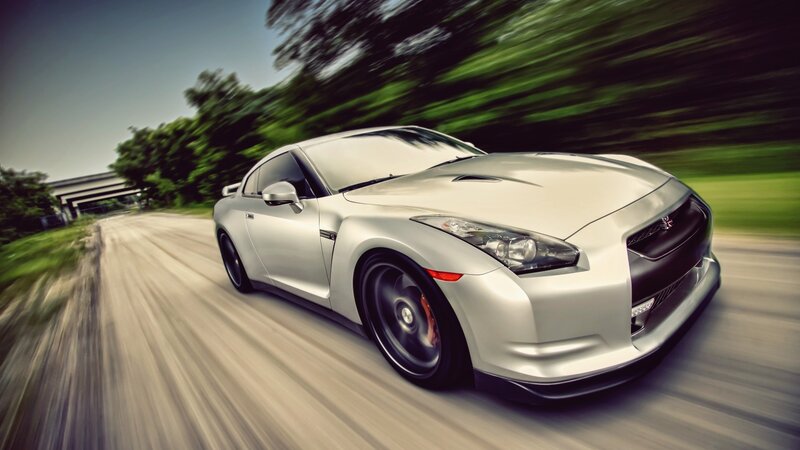 silver sports car in motion