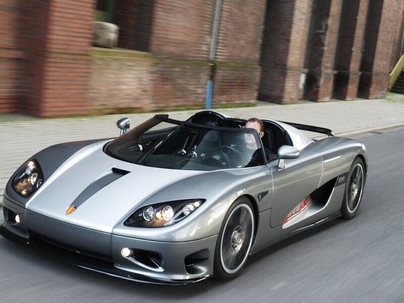 silver sports car in motion