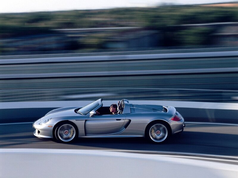 Silver sports car in motion