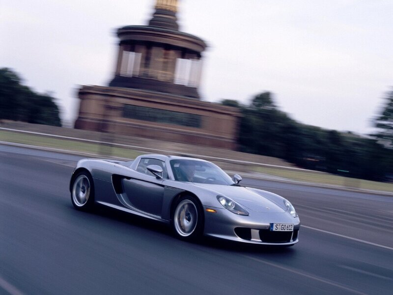 silver sports car in motion