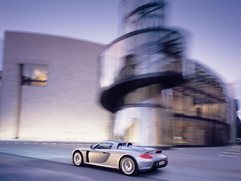 Silver sports car in motion