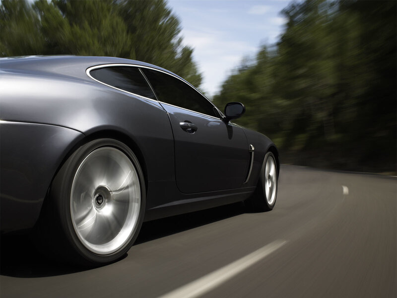 silver sports car in motion