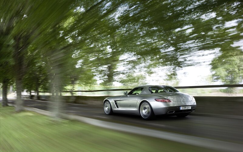 Silver sports car in motion