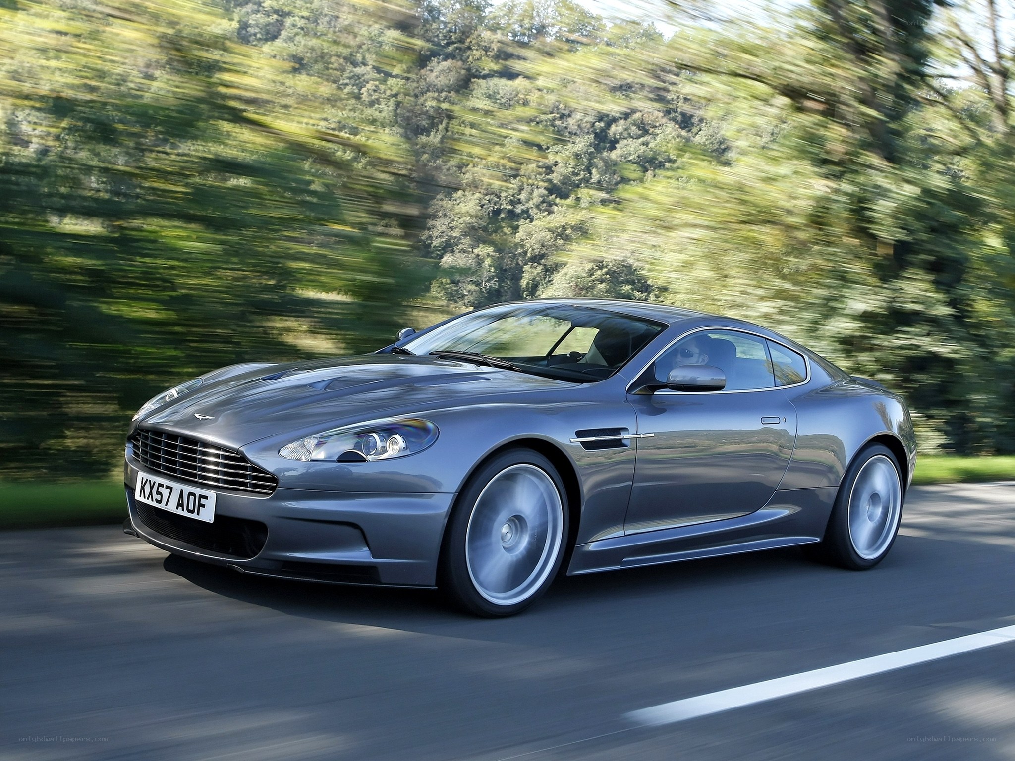 silver sports car in motion