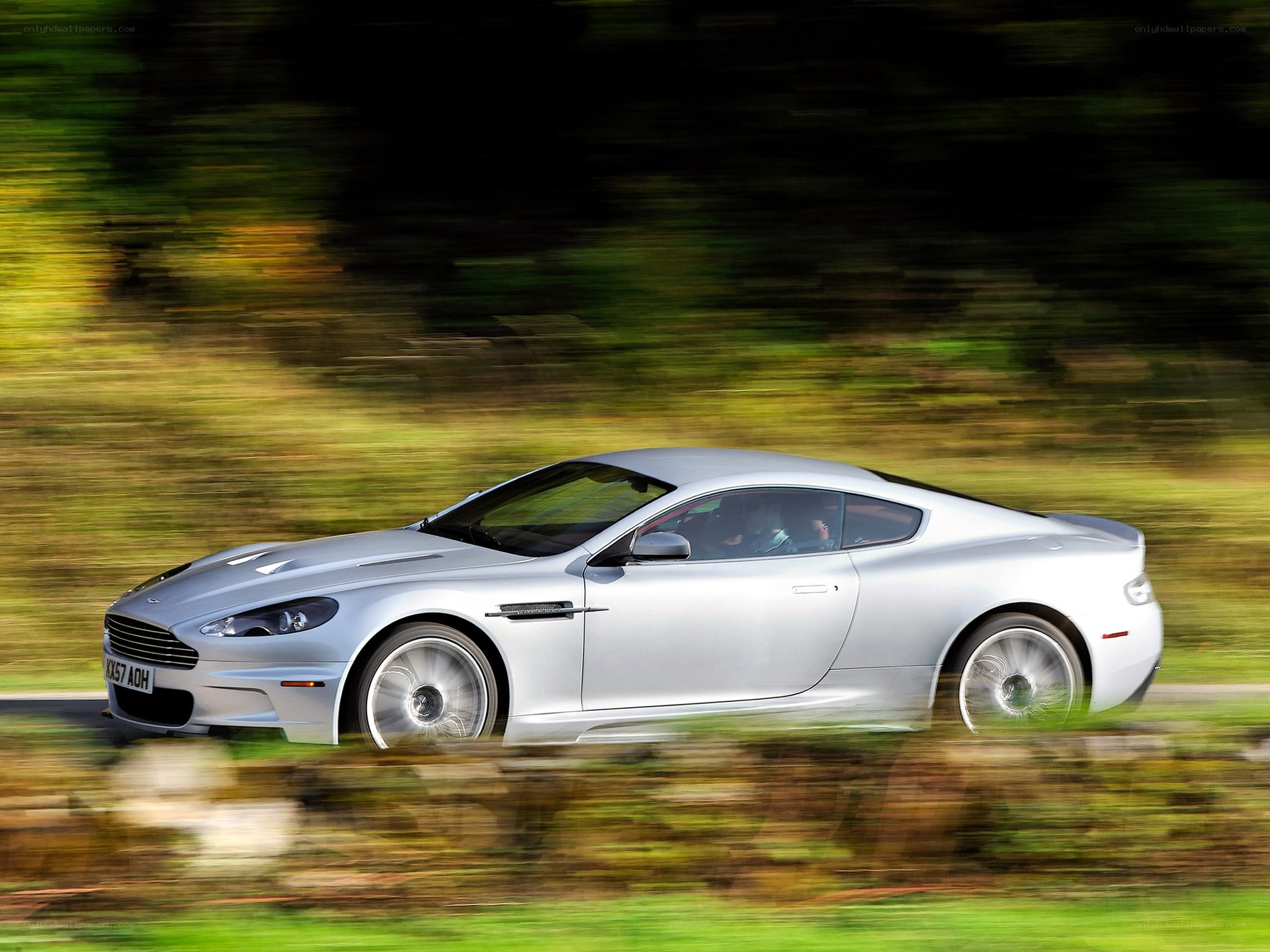 silver sports car in motion