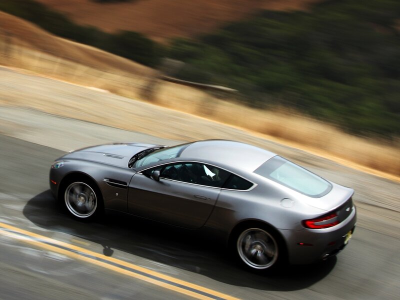 silver sports car in motion