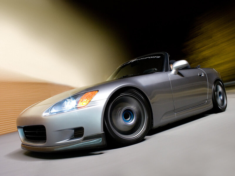 Silver sports car in motion
