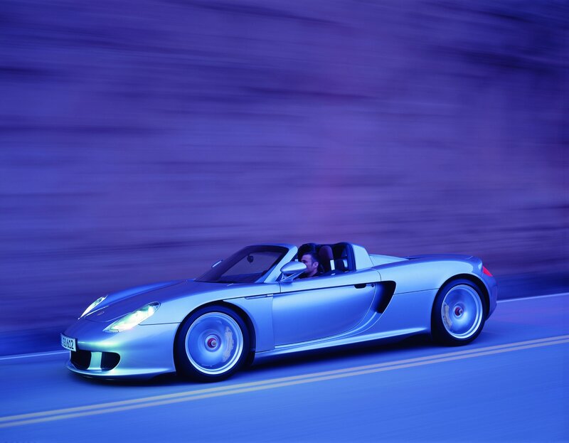 Silver sports car in motion