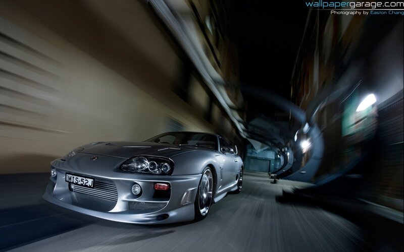 silver sports car in motion