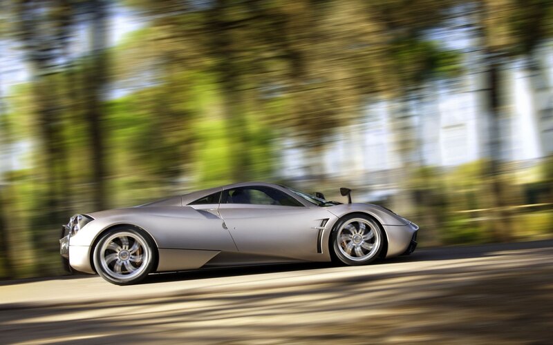 Silver sports car in motion