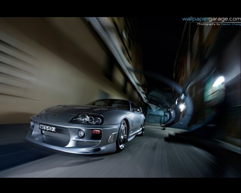 silver sports car in motion