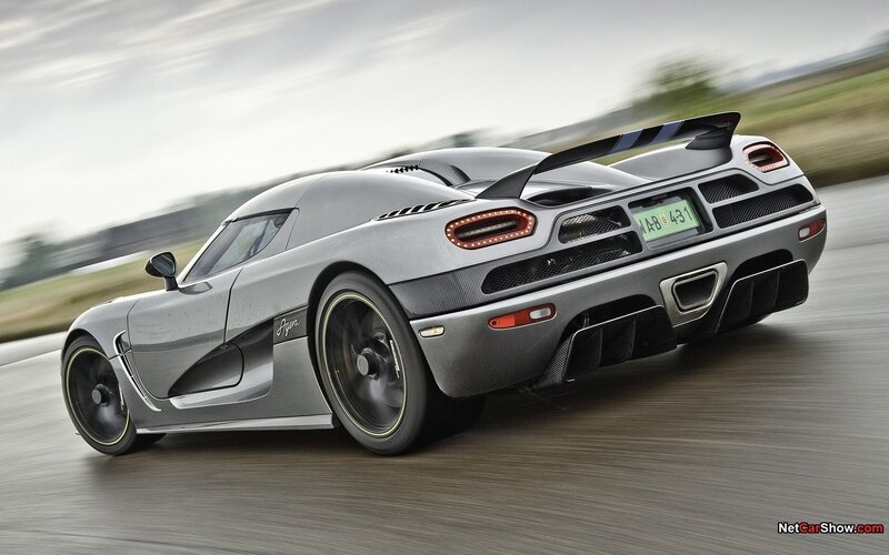 silver sports car in motion