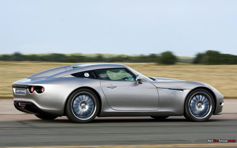silver sports car in motion