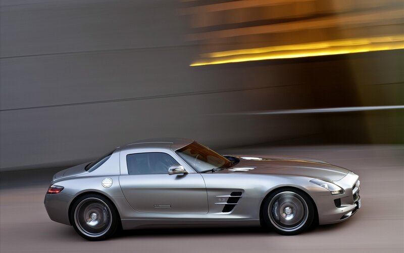 Silver sports car in motion