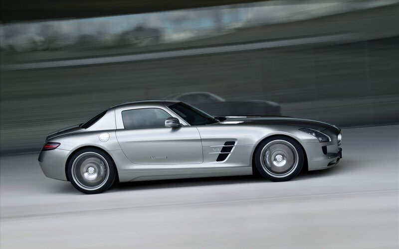 silver sports car in motion