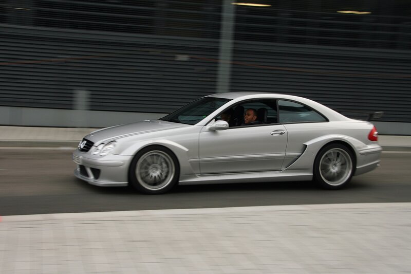 silver sports car in motion