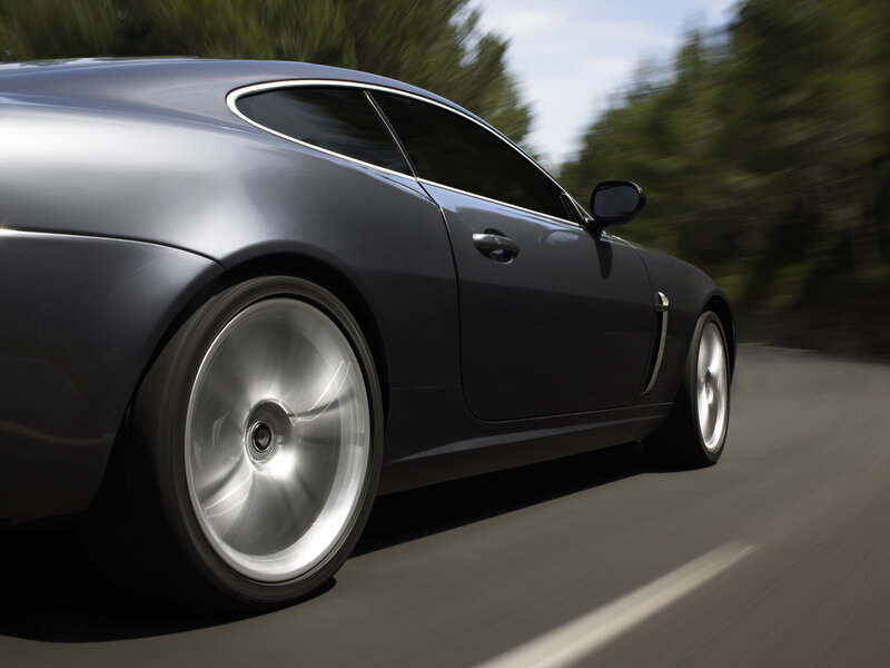 silver sports car in motion